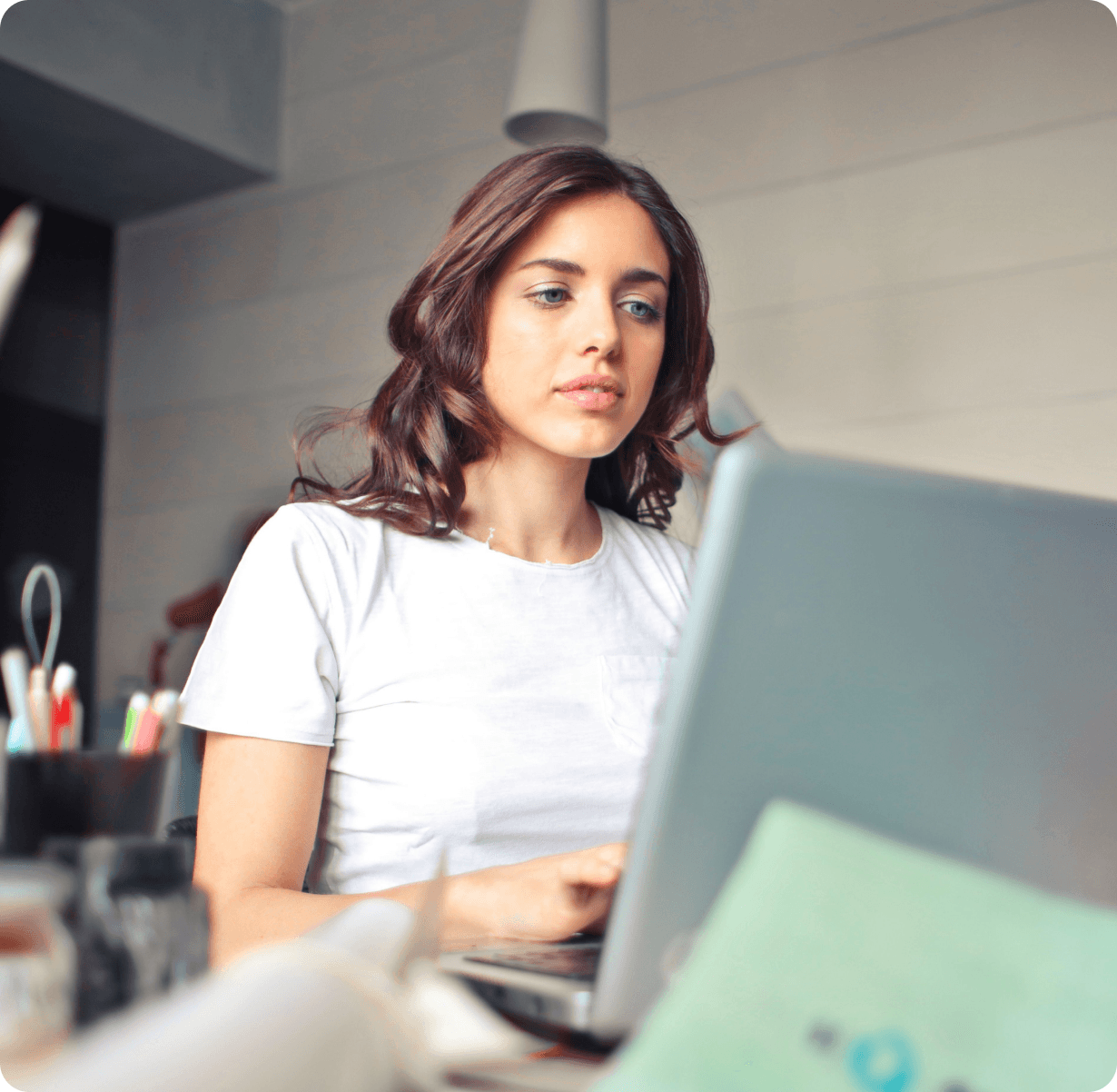 Professional working on a laptop in a co-working space